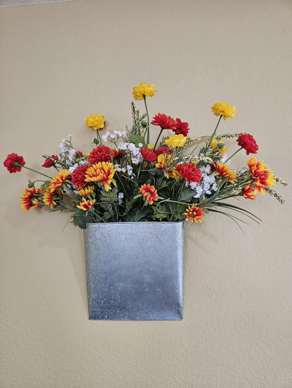 Decorative Silver Wall Pocket with Faux Red And Yellow Floral Arrangement